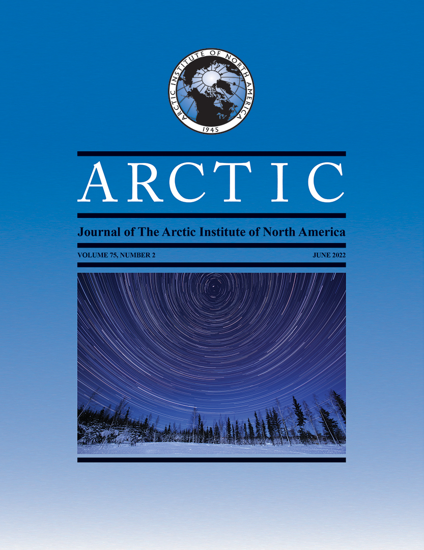 Cover of the ARCTIC journal showing a night sky with polar star trails over a snow-covered landscape.